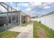 Spacious backyard with patio and grassy area, perfect for outdoor activities at 1369 Saxon Blvd, Deltona, FL 32725