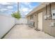 Cozy backyard patio with seating and a door leading into the home at 1369 Saxon Blvd, Deltona, FL 32725