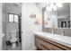 Stylish bathroom with double sinks, updated lighting, and a separate toilet area, maximizing space at 1369 Saxon Blvd, Deltona, FL 32725