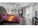 Calm main bedroom with hardwood floors, french doors, and neutral walls creating a relaxing retreat at 1369 Saxon Blvd, Deltona, FL 32725