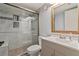 Updated bathroom featuring a glass-enclosed shower and modern vanity with a framed mirror at 140 Orchid Woods Ct # 14B, Deltona, FL 32725