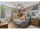 Fun bedroom with a ceiling fan, natural light, decorated with posters and stuffed animals at 140 Orchid Woods Ct # 14B, Deltona, FL 32725
