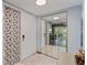 Inviting entryway with mirrored closet doors leading to a living area at 140 Orchid Woods Ct # 14B, Deltona, FL 32725