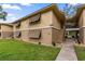 Condo exterior featuring shuttered windows and well-maintained landscaping, offering curb appeal and a welcoming facade at 140 Orchid Woods Ct # 14B, Deltona, FL 32725