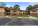 Condo complex featuring well-maintained landscaping, convenient parking, and a welcoming atmosphere at 140 Orchid Woods Ct # 14B, Deltona, FL 32725