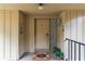 Inviting entryway features a 'Bee Happy' doormat and unique decor, adding a touch of charm to the condo at 140 Orchid Woods Ct # 14B, Deltona, FL 32725