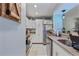 Bright kitchen featuring stainless steel appliances and white cabinetry with lots of storage space at 140 Orchid Woods Ct # 14B, Deltona, FL 32725