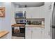 Bright kitchen featuring stainless steel appliances and white cabinetry with lots of storage space at 140 Orchid Woods Ct # 14B, Deltona, FL 32725