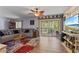 Inviting living room with natural light, modern flooring, and easy access to the outdoor balcony at 140 Orchid Woods Ct # 14B, Deltona, FL 32725
