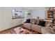 Well-lit living room with stylish flooring, seamlessly connecting to the modern kitchen at 140 Orchid Woods Ct # 14B, Deltona, FL 32725