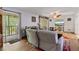 Comfortable living room with balcony access, inviting natural light and scenic views at 140 Orchid Woods Ct # 14B, Deltona, FL 32725