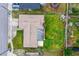 Birds-eye view of single Gathering home featuring a well-manicured lawn and fenced backyard at 1426 Saxon Blvd, Deltona, FL 32725