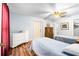Bright bedroom featuring two twin beds, wood floors, and ample closet space at 1426 Saxon Blvd, Deltona, FL 32725