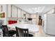 Bright kitchen equipped with counter seating and appliances, offering a functional and stylish cooking space at 1426 Saxon Blvd, Deltona, FL 32725