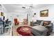 Cozy living room features a neutral sofa with chaise and a decorative rug at 1426 Saxon Blvd, Deltona, FL 32725