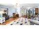 Comfortable living area showcasing hardwood floors, plush seating, and ample natural light, perfect for gatherings at 1426 Saxon Blvd, Deltona, FL 32725