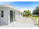 The backyard features a tile patio with access to a sliding glass door and a grassy area at 1479 Renton St, Deltona, FL 32725