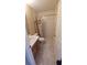 Bathroom featuring marble tile, vanity with marble top, and shower with patterned shower curtain at 1491 E Palomar Dr, Deltona, FL 32738
