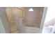 Bathroom featuring shower, soaking tub, and tiled accents at 1491 E Palomar Dr, Deltona, FL 32738