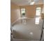 Bright bedroom with tile flooring, ceiling fan, and natural light from two windows at 1491 E Palomar Dr, Deltona, FL 32738