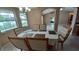 Dining room with a chandelier and a view of the screened-in pool at 1491 E Palomar Dr, Deltona, FL 32738