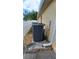 Exterior of home with central AC unit and white vinyl fence in backyard at 1491 E Palomar Dr, Deltona, FL 32738