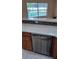 Kitchen features stainless steel dishwasher and stone countertops and a pool view at 1491 E Palomar Dr, Deltona, FL 32738