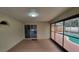 Covered lanai with sliding glass doors and access to the pool area at 1491 E Palomar Dr, Deltona, FL 32738