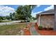 Landscaped walkway leading to the home with fresh mulch and green plants at 1491 E Palomar Dr, Deltona, FL 32738