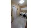 A laundry room with new, front-loading washer and dryer at 1491 E Palomar Dr, Deltona, FL 32738