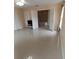 Open Primary bedroom featuring tile floors, ceiling fan, and an ensuite bath at 1491 E Palomar Dr, Deltona, FL 32738