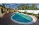Inviting screened-in pool area with a sparkling blue pool and spacious deck at 1491 E Palomar Dr, Deltona, FL 32738