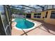 Wide view of screened-in pool and outdoor space with nice view and privacy fence at 1491 E Palomar Dr, Deltona, FL 32738