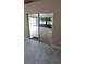 Open sliding doors to a sunroom with screened windows and carpeted floors, providing access to outdoor views at 1491 E Palomar Dr, Deltona, FL 32738