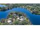 Wide angle aerial view showing the neighborhood with lake and the position of this lakefront property at 160 Rose Ave, Lake Helen, FL 32744