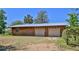 Exterior of the detached two-car garage with wood siding and two white garage doors at 160 Rose Ave, Lake Helen, FL 32744