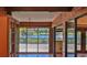 Stunning lake view from an interior space with a wooden deck and natural light at 160 Rose Ave, Lake Helen, FL 32744
