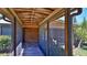 The screened-in porch has a wood plank floor and a view of the outdoors at 160 Rose Ave, Lake Helen, FL 32744
