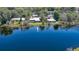 Aerial view showing the home located on a lakefront property at 160 Rose Ave, Lake Helen, FL 32744