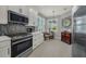 Well-equipped kitchen with stainless steel appliances, sleek cabinetry, and a stylish backsplash at 173 Old Moss Cir, Deland, FL 32724