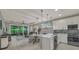 Open-concept living and kitchen area featuring modern appliances and plenty of natural light at 173 Old Moss Cir, Deland, FL 32724
