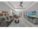 Spacious living room with a comfortable seating arrangement, open to the kitchen and dining area at 173 Old Moss Cir, Deland, FL 32724