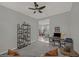 Cozy living room with neutral decor, a ceiling fan, and an open view into the dining area at 173 Old Moss Cir, Deland, FL 32724