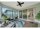 Inviting screened patio with brick flooring, overlooking the landscaped backyard and seamlessly connected to the interior at 173 Old Moss Cir, Deland, FL 32724