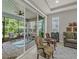 Screened patio area, perfect for outdoor relaxation and entertaining, with views of the backyard at 173 Old Moss Cir, Deland, FL 32724