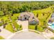 Expansive estate featuring a meticulously landscaped yard, circular driveway, and pristine surroundings at 1855 Cattle Creek Ln, Port Orange, FL 32128