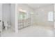 Bright bathroom with a glass-enclosed shower, tiled floor, and marble countertops at 1855 Cattle Creek Ln, Port Orange, FL 32128
