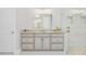 Elegant bathroom showcasing a granite vanity, framed mirror, and a modern walk-in shower with decorative tile at 1855 Cattle Creek Ln, Port Orange, FL 32128