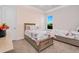 Comfortable bedroom with twin beds, neutral decor, and ample natural light creating a cozy and inviting atmosphere at 1855 Cattle Creek Ln, Port Orange, FL 32128