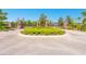 Gated community entrance featuring brick pillars and manicured landscaping for added security and curb appeal at 1855 Cattle Creek Ln, Port Orange, FL 32128